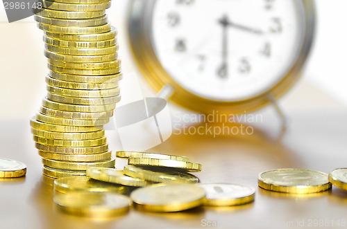 Image of Alarm clock and money
