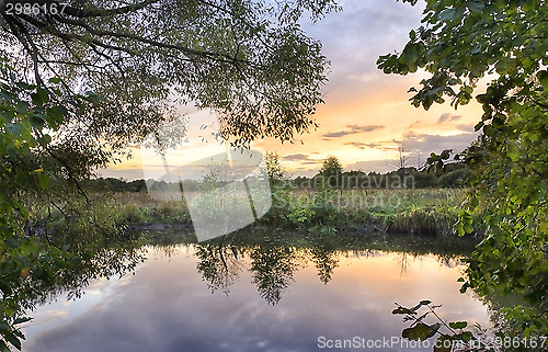 Image of Colourful sunset over the river