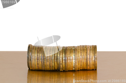 Image of A stack of coins, placed horizontally on a white background