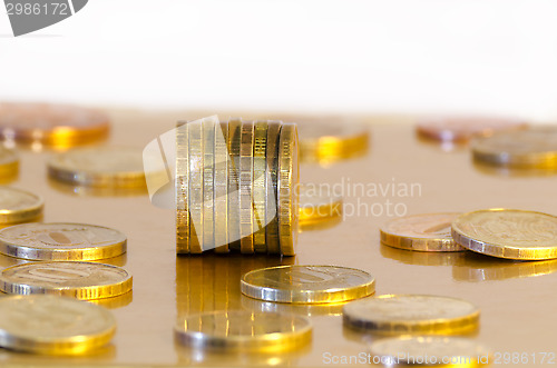 Image of Coins are reflecting in the Golden surface