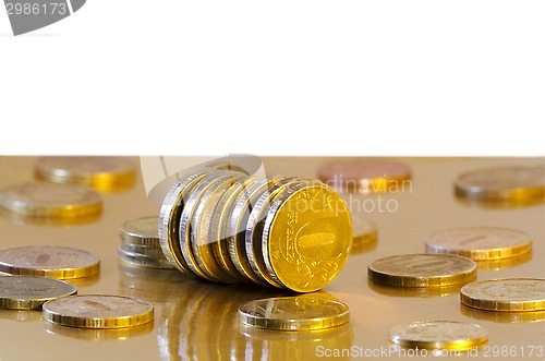 Image of Coins are reflecting in the Golden surface