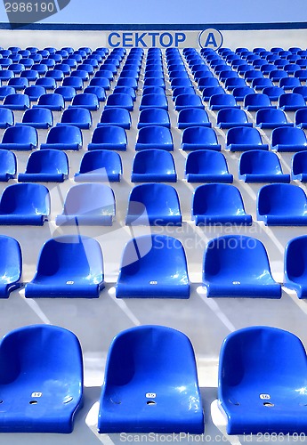 Image of sector of the stadium with the inscription "A" with blue chairs