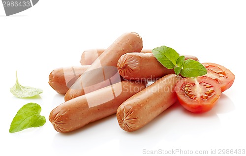 Image of sausages and tomato