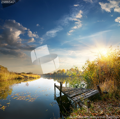 Image of Old pier on autumn river