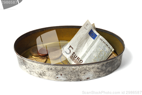 Image of Tin can with money