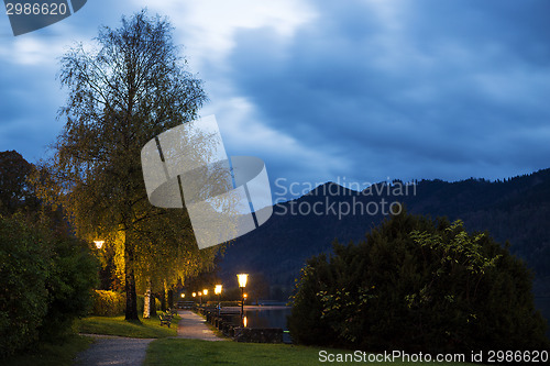 Image of Bavarian lake Schliersee with dramatic clouds at night