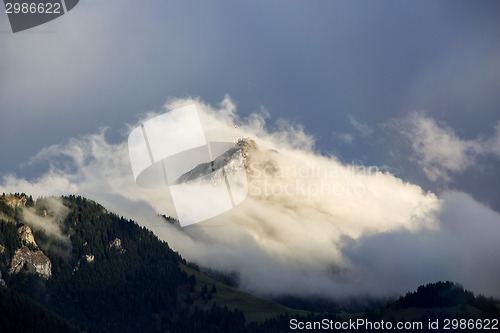 Image of Bavarian mountain Wendelstein with fog in autumn