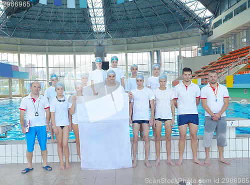 Image of children group  at swimming pool with empty white flag