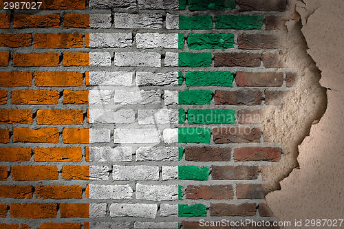 Image of Dark brick wall with plaster - Ivory Coast