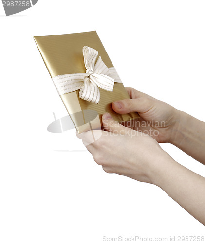 Image of Young woman holding a present