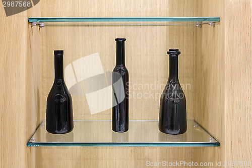 Image of Three Empty black bottles