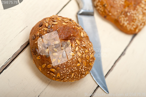 Image of organic bread over rustic table