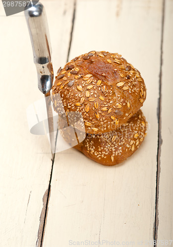 Image of organic bread over rustic table