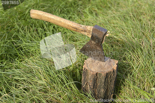 Image of Firewood and old axe