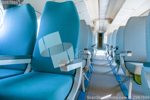 Image of Interior of an airplane with many seats