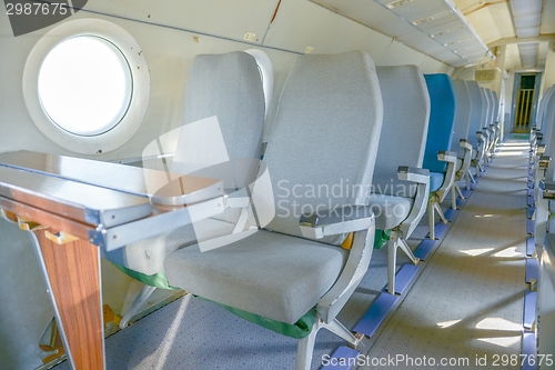 Image of Interior of an airplane with many seats