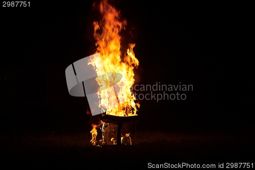 Image of Chair on Fire burning in the night