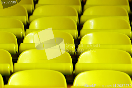 Image of Yellow chairs in rows