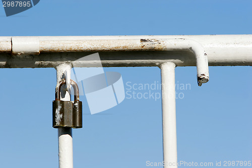 Image of Key on iron fence