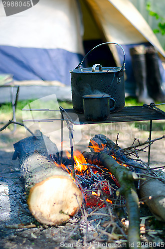 Image of Tourist boiler mug and heated over a fire of wood