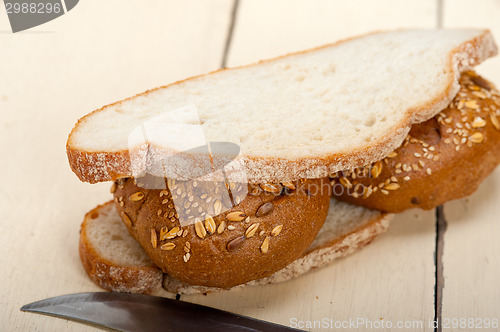 Image of organic bread over rustic table