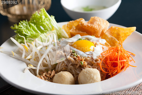 Image of Thai Noodle Dish with Fried Egg