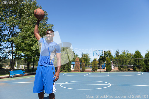 Image of Basketball Player Palming the Ball