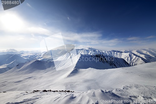 Image of Off-piste slope and sky with sun