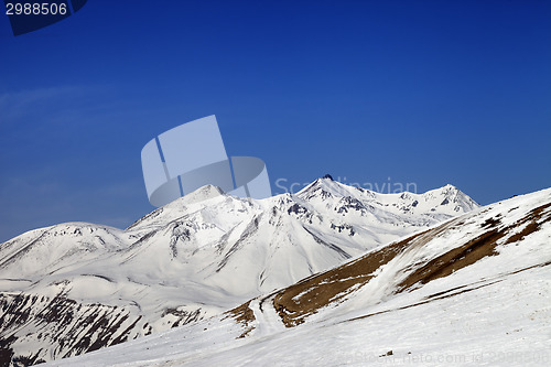Image of Ski slope and snowy mountains