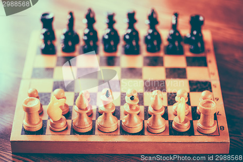 Image of Ancient Wooden Chess Standing On Chessboard