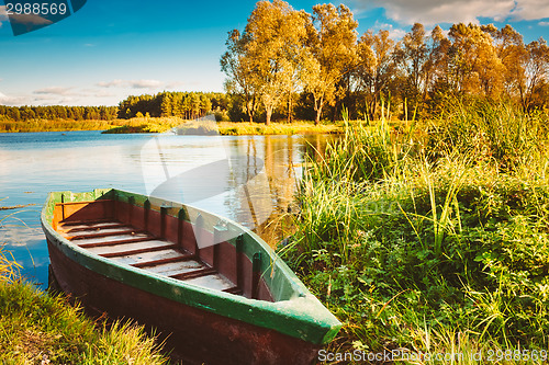 Image of Old Wooden Fishing Boat In River