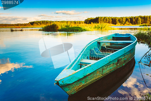 Image of Old Wooden Fishing Boat In River