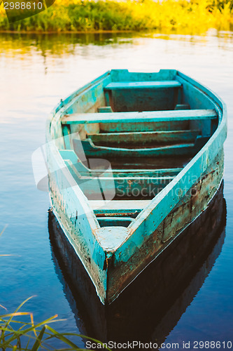 Image of Old Wooden Fishing Boat In River