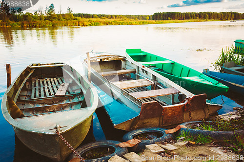 Image of Old Fishing Boats In River