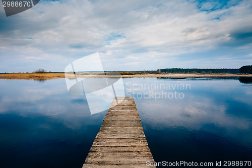 Image of Old Wooden Pier. Calm River