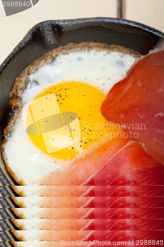 Image of egg sunny side up with italian speck ham