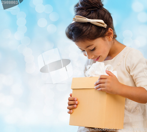 Image of smiling little girl with gift box