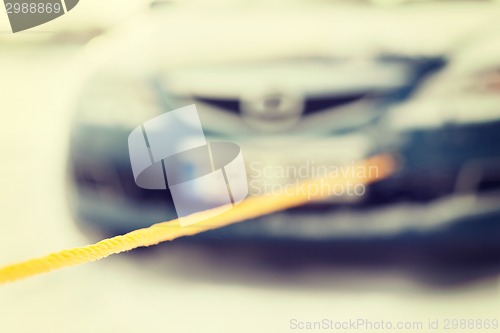 Image of closeup of towed car with towing rope