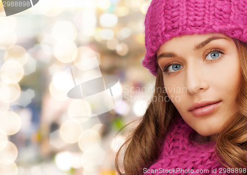 Image of close up of smiling young woman in winter clothes