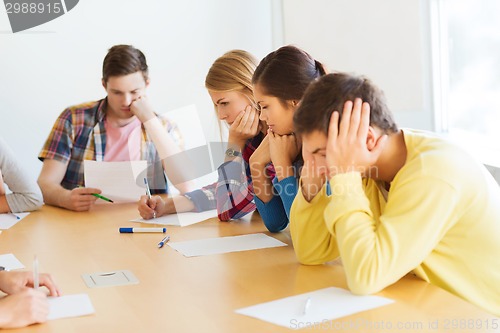 Image of group of students with papers