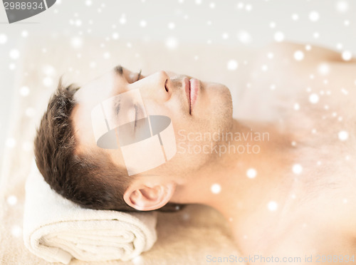 Image of close up of young man face in spa