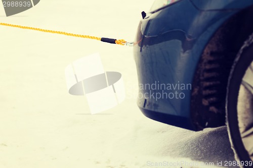 Image of closeup of towed car with towing rope