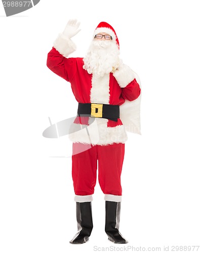 Image of man in costume of santa claus with bag