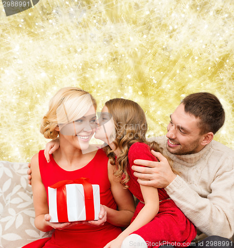 Image of happy family with gift box