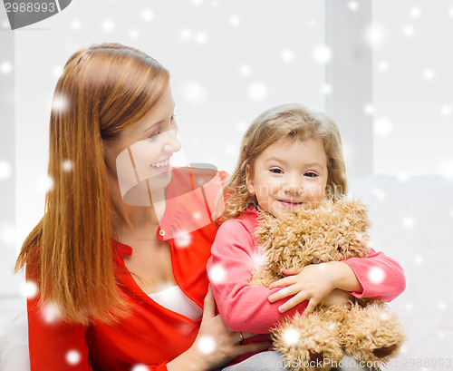 Image of mother and daughter with teddy bear toy