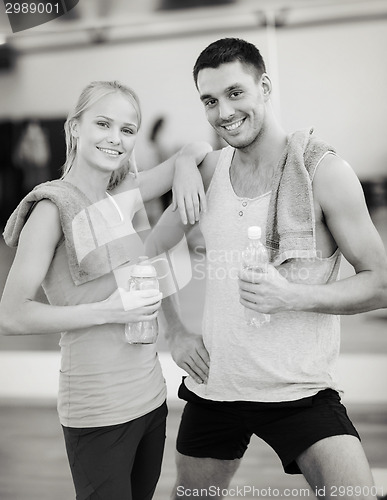Image of two smiling people in the gym