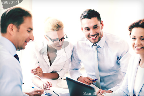 Image of businesswoman with team on meeting in office