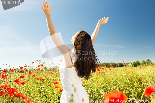 Image of young woman on poppy field