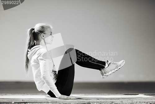Image of woman doing sports outdoors