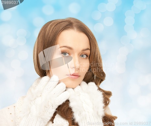 Image of smiling young woman in winter clothes